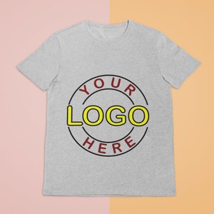 May include: A gray t-shirt with a red and black circle design that says "YOUR LOGO HERE" in yellow letters.