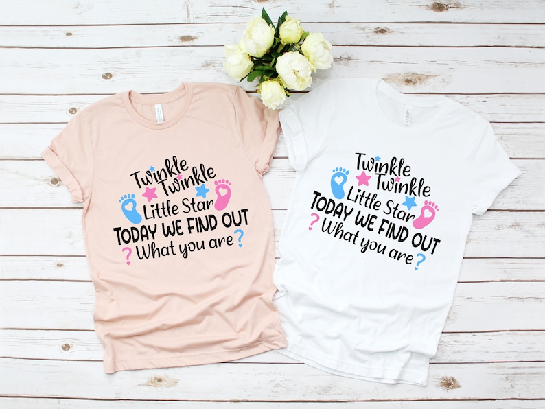 May include: Two gender reveal t-shirts with the text "Twinkle Twinkle Little Star Today We Find Out? What You Are?" on a pink and white background.