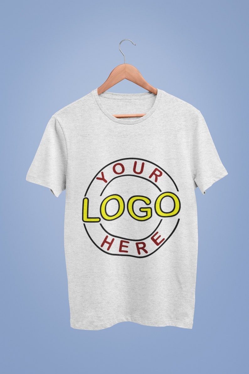 May include: A gray t-shirt with a black circle and the text "YOUR LOGO HERE" in red and yellow.