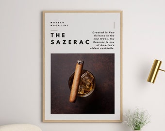Könnte beinhalten: Ein gerahmtes Poster mit braunem Hintergrund und einem Glas Eis, auf dem ein Zigarre liegt. Das Poster trägt den Text "MODERN MAGAZINE THE SAZERAC In New Orleans Mitte des 19. Jahrhunderts kreiert, ist der Sazerac einer der ältesten Cocktails Amerikas."