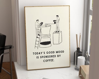 May include: A framed black and white illustration of two people making coffee. The text below the illustration reads "Today's good mood is sponsored by coffee."