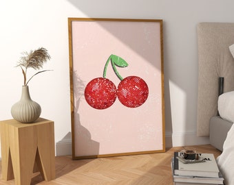 Peut inclure: Une impression encadrée d'une cerise rouge avec une tige verte sur fond rose.