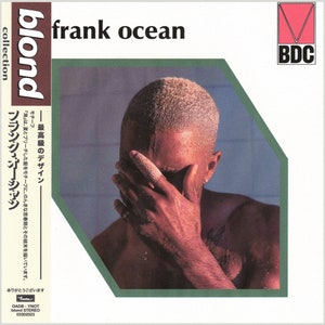 May include: Album cover for "Blond" by Frank Ocean. The cover features a person with wet, bleached blonde hair, covering their face with their hand. The album title and artist name are in black text. Japanese text is also present.