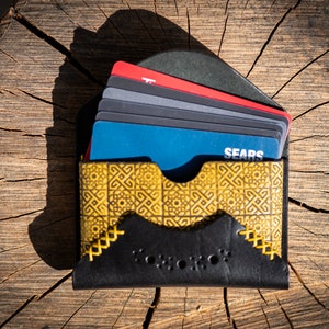 Cartera y tarjetero de cuero
