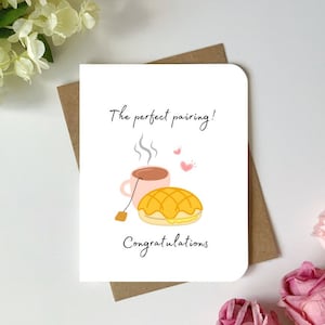 Jolie carte de voeux pour les jeunes mariés avec jeu de mots, petit pain à l'ananas et thé au lait