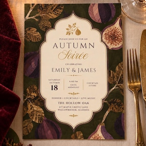 May include: A rectangular invitation card for an Autumn Soirée celebrating Emily and James on Saturday, October 18. The card features a dark green background with illustrations of purple figs and gold leaves, surrounding a cream-colored central frame.