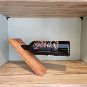 Floating wine bottle holder