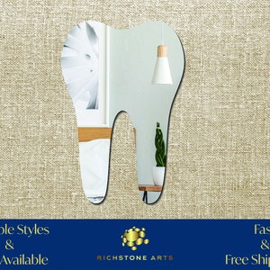 May include: A tooth-shaped mirror with a reflective surface. The mirror is made of acrylic and has a smooth, polished finish. The mirror is a great way to add a touch of whimsy to any room.