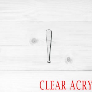 May include: A white baseball bat cutout made of clear acrylic.
