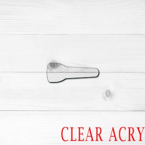 May include: A clear acrylic flashlight shape, cut out from a sheet of clear acrylic.