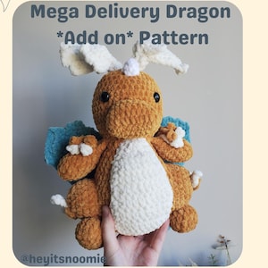 May include: A crocheted dragon plush toy in shades of orange, white, and blue. The dragon has large, fluffy wings and a white belly. The image includes the text "Mega Delivery Dragon *Add on* Pattern".