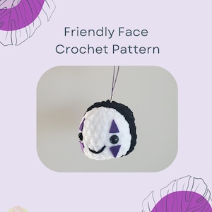 May include: Crochet pattern for a friendly face amigurumi. The face is white with purple details and black eyes. The pattern is called "Friendly Face Crochet Pattern".