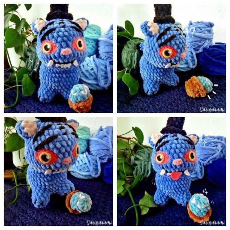 May include: A handmade blue crochet monster toy with a black top hat, orange eyes, and a pink nose. The plushie has a small tongue sticking out and is surrounded by blue yarn and a small cupcake-like toy. The toy is a unique, whimsical creation.