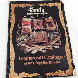 May include: A Tandy Leather Company catalogue featuring a variety of leather goods, including purses, belts, and tools. The catalogue cover features the text "Leathercraft Catalogue of Kits, Supplies & Ideas".