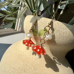 Mushroom Dangle Earrings – Red Toadstool Glass Earrings with Leaf Charm | Cottagecore Fairycore Jewelry | Whimsical Forest Gift for Her