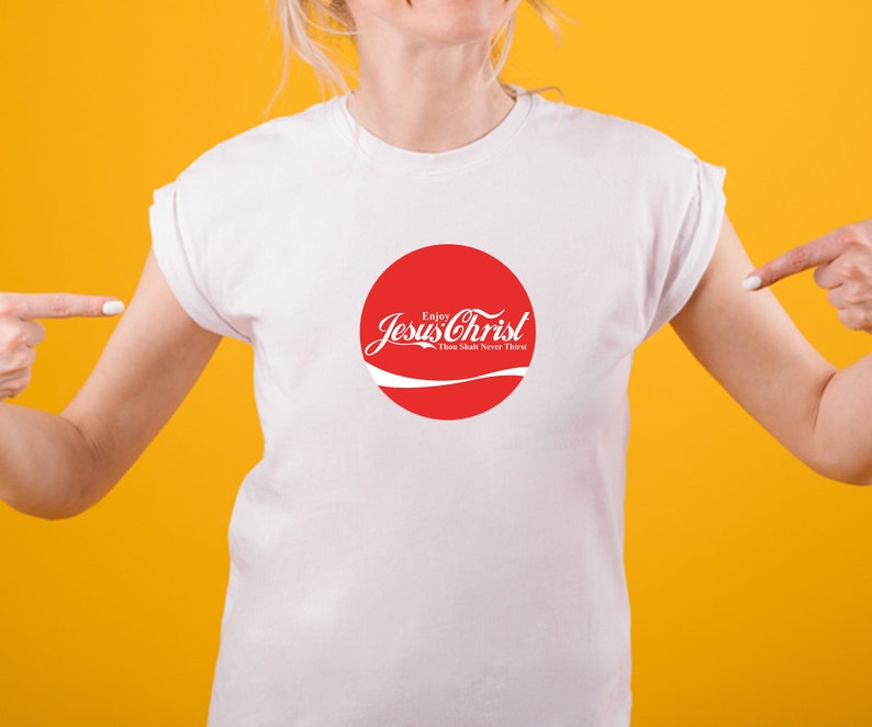 May include: White t-shirt with a red circle graphic that says "Enjoy Jesus Christ Thou Shalt Never Thirst".