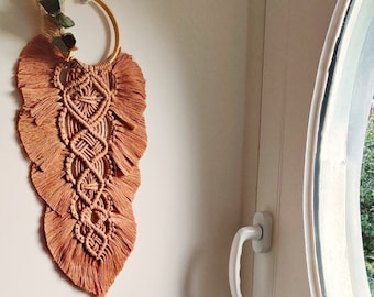 Macrame wall decoration and dried flowers