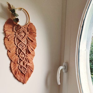 Macrame and dried flower wall decoration
