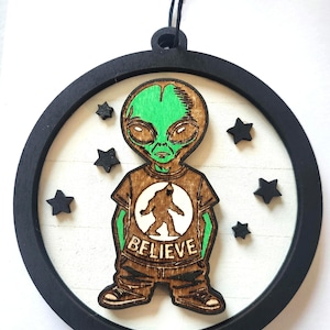 Alien wearing Bigfoot Believe T-Shirt Wooden Shiplap Ornament for Cryptid Lovers