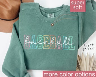 May include: Light green sweatshirt with the word "BASEBALL" written in rainbow colors. The sweatshirt is super soft and has more color options.