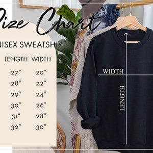 Puede incluir: Tabla de tallas para una sudadera unisex. La tabla muestra la longitud y el ancho en pulgadas para las tallas S, M, L, XL, 2X y 3X.