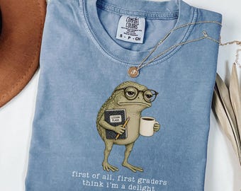 Comfort Colors First Grade Teacher Shirt First Of All First Graders Think I'm A Delight Shirt Funny Frog 1st Grade Back To School Gift Idea