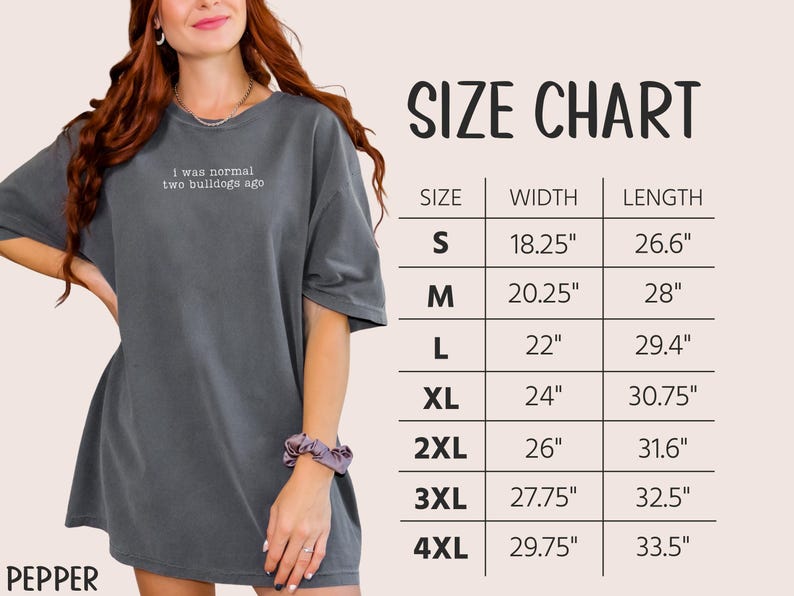 May include: A gray t-shirt with the embroidered text "I was normal two bulldogs ago." A size chart is displayed, showing measurements in inches for sizes S through 4XL. The shirt is a relaxed fit.