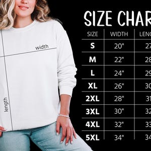 May include: A white sweatshirt with a size chart on a black background. The size chart lists sizes S through 5XL, with corresponding width and length measurements in inches. The sweatshirt is being modeled.