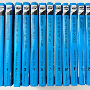May include: A collection of vintage Hardy Boys books with blue spines. Titles include "The Tower Treasure," "The House on the Cliff," and "The Secret of the Old Mill." Each book features the author's name, Franklin W. Dixon, and the publisher, Grosset & Dunlap.