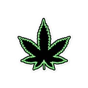 Könnte beinhalten: Ein schwarzes Marihuana-Blatt mit einem grünen Neon-Umriss. Das Blatt ist mit gezackten Rändern stilisiert.