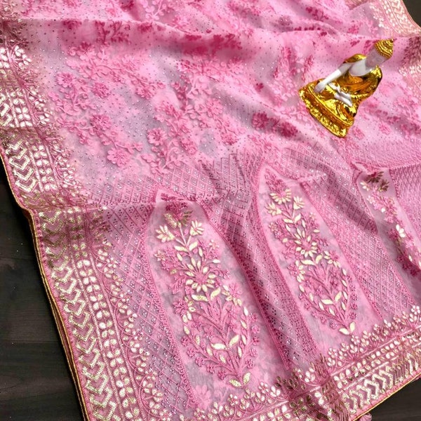 Designer organza silk saree with beautiful embroidery work all over comes with blended shining blouse