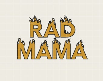 May include: A graphic design featuring the words "RAD MAMA" in a bold, gold font with black outlines. Flames are incorporated into the design, appearing above the letters. The background is a light beige color with a subtle grid pattern.