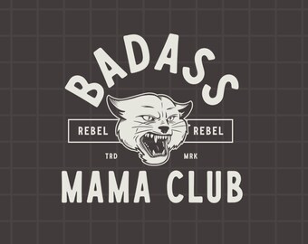 May include: A graphic design featuring the words "BADASS MAMA CLUB" in a bold, vintage font. A fierce cat illustration is centered, with the word "REBEL" on either side. The background is a dark gray grid.