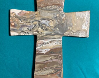 Beautifully painted cross in natural tones.