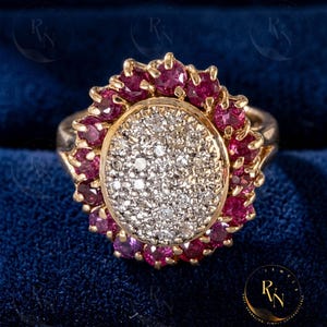 May include: A white ceramic mug with a black handle and the text "But first, coffee" in a handwritten style. The mug is on a white surface. The mug is likely for hot beverages.