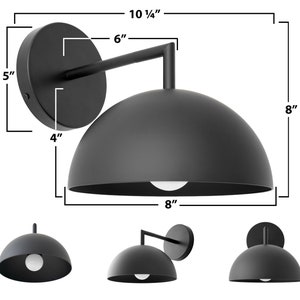 Puede incluir: Aplique de pared exterior negro en forma de c&uacute;pula con un brazo de 15 cm. La luz tiene un di&aacute;metro de 20 cm y una altura de 26 cm.
