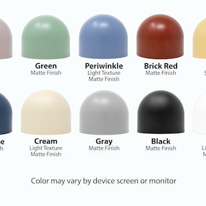 Puede incluir: Diez objetos en forma de c&uacute;pula de diferentes colores con diferentes acabados, incluyendo mate y satinado. Los colores son malva, verde, azul periwinkle, rojo ladrillo, amarillo, azul carb&oacute;n, crema, gris, negro y blanco. El texto debajo de cada objeto describe el color y el acabado.
