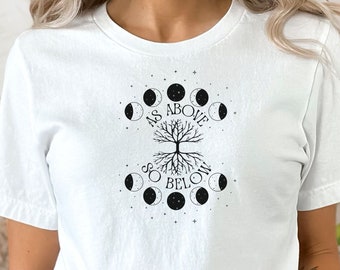May include: White t-shirt with a black graphic of a tree with roots and moon phases around it. The text "As Above So Below" is written on the graphic.