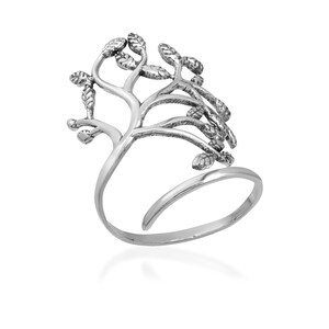 May include: A silver ring with a tree design. The ring is open and adjustable.