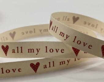 May include: Cream-colored ribbon with the words "all my love" printed in red, along with red heart illustrations. The ribbon is curled and layered, with the text and hearts repeating along its length. The ribbon is likely used for crafts or gift wrapping.