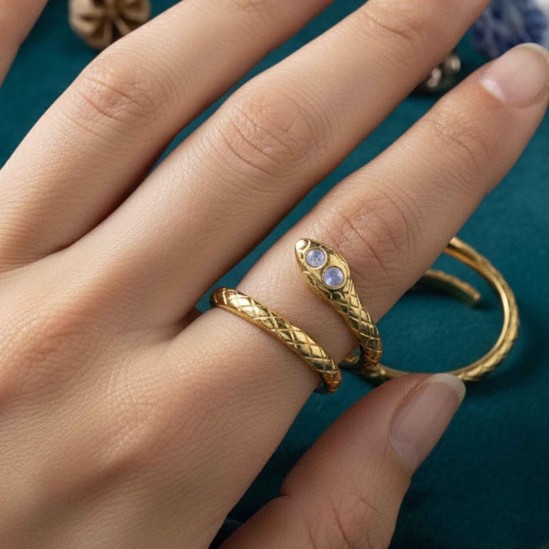 May include: A set of three ceramic mugs with a speckled, matte finish. The mugs are in shades of cream, light gray, and dark gray. Each mug has a simple, minimalist design, perfect for coffee or tea.