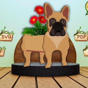May include: A wooden French Bulldog planter with a brown body, black snout, and large ears. The planter holds red flowers and green foliage. Digital download options include SVG, DXF, PDF, and AI files.