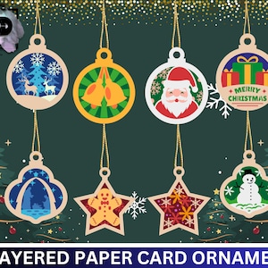 May include: Eight layered paper card ornaments with various Christmas themes. The ornaments feature a snowman, Santa Claus, a reindeer, a bell, a gingerbread man, a snowflake, and a Christmas tree. The ornaments are all white with colourful designs.