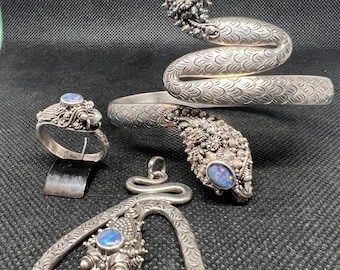 Antique silver dragon set with opal