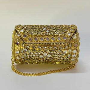 Metal kundan party clutch