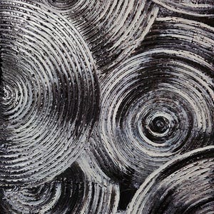 May include: Abstract artwork featuring overlapping concentric circles in shades of black and white. The textured surface creates a sense of depth and movement, with the white paint highlighting the spiral patterns.