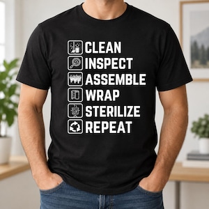 May include: A black short-sleeved t-shirt featuring white text and icons arranged in a vertical list. The text reads: CLEAN, INSPECT, ASSEMBLE, WRAP, STERILIZE, REPEAT. Each word is accompanied by a corresponding white line-art icon in a square box.