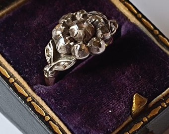 An Antique 14ct gold flower ring with rosecut diamonds set in silver
