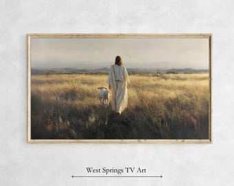 May include: A framed print depicts a figure in white robes walking through a field of tall grass, followed by a lamb. The artwork has a warm color palette with a soft, natural light. The text "West Springs TV Art" is at the bottom.