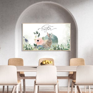 May include: A watercolor painting of a bunny rabbit with the text "Happy Easter" in a white frame hanging on a wall above a wooden table with four chairs.